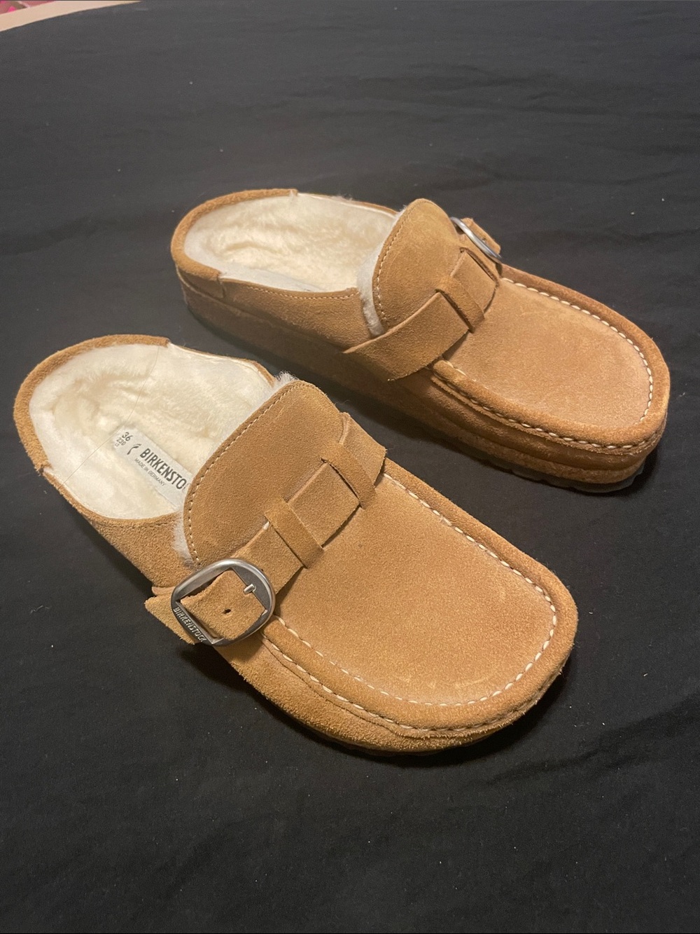 Tan/brown slip on Birkenstocks